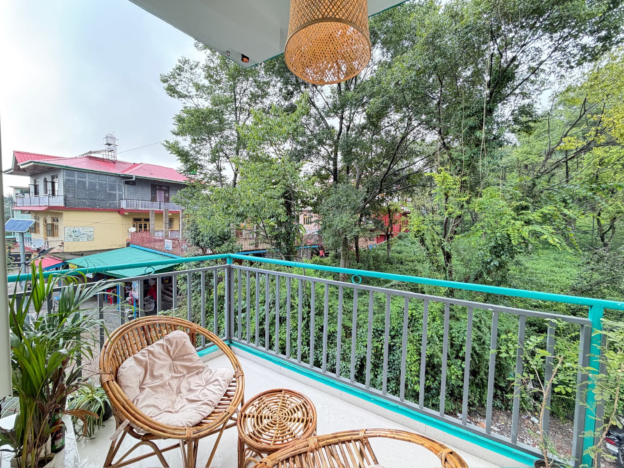 View from a private balcony at Dimora Homes over the trees and rooftops of Bir