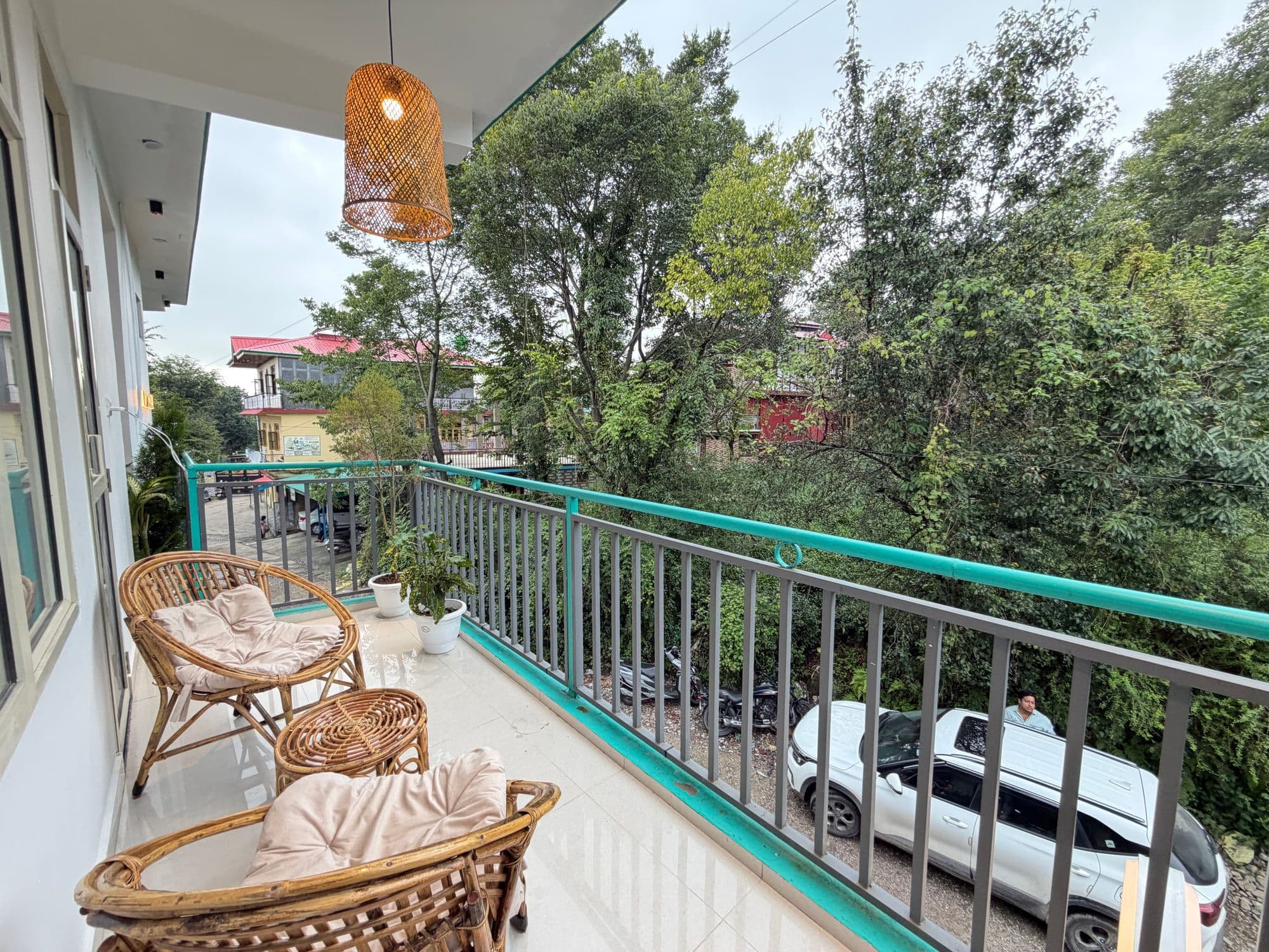 Balcony at Dimora Homes looking into deodar and pine trees