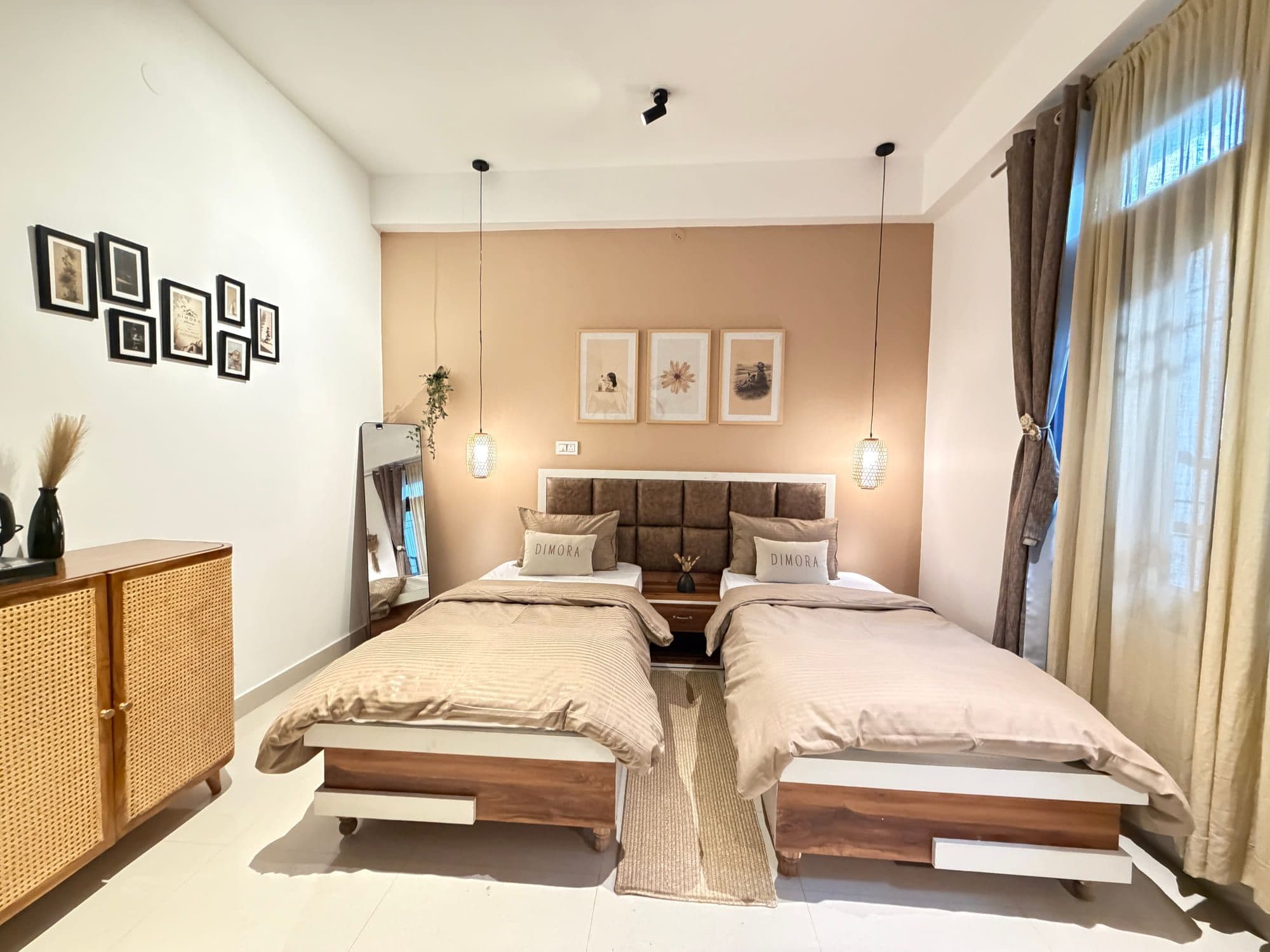 Twin room at Dimora Homes with two single beds, a mocha accent wall and a full-length mirror