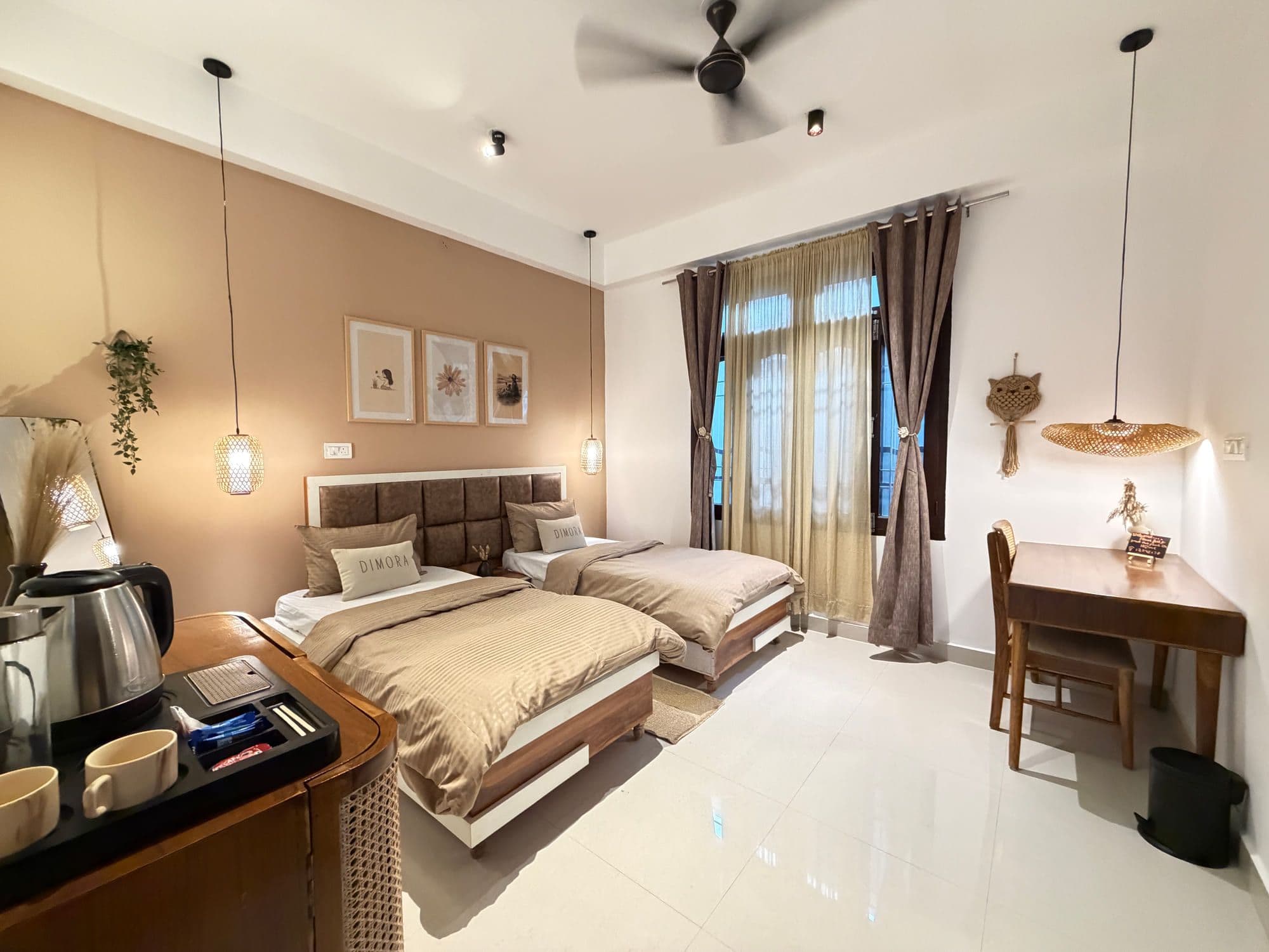 Twin Room at Dimora Homes with two single beds, a mocha accent wall and a writing desk